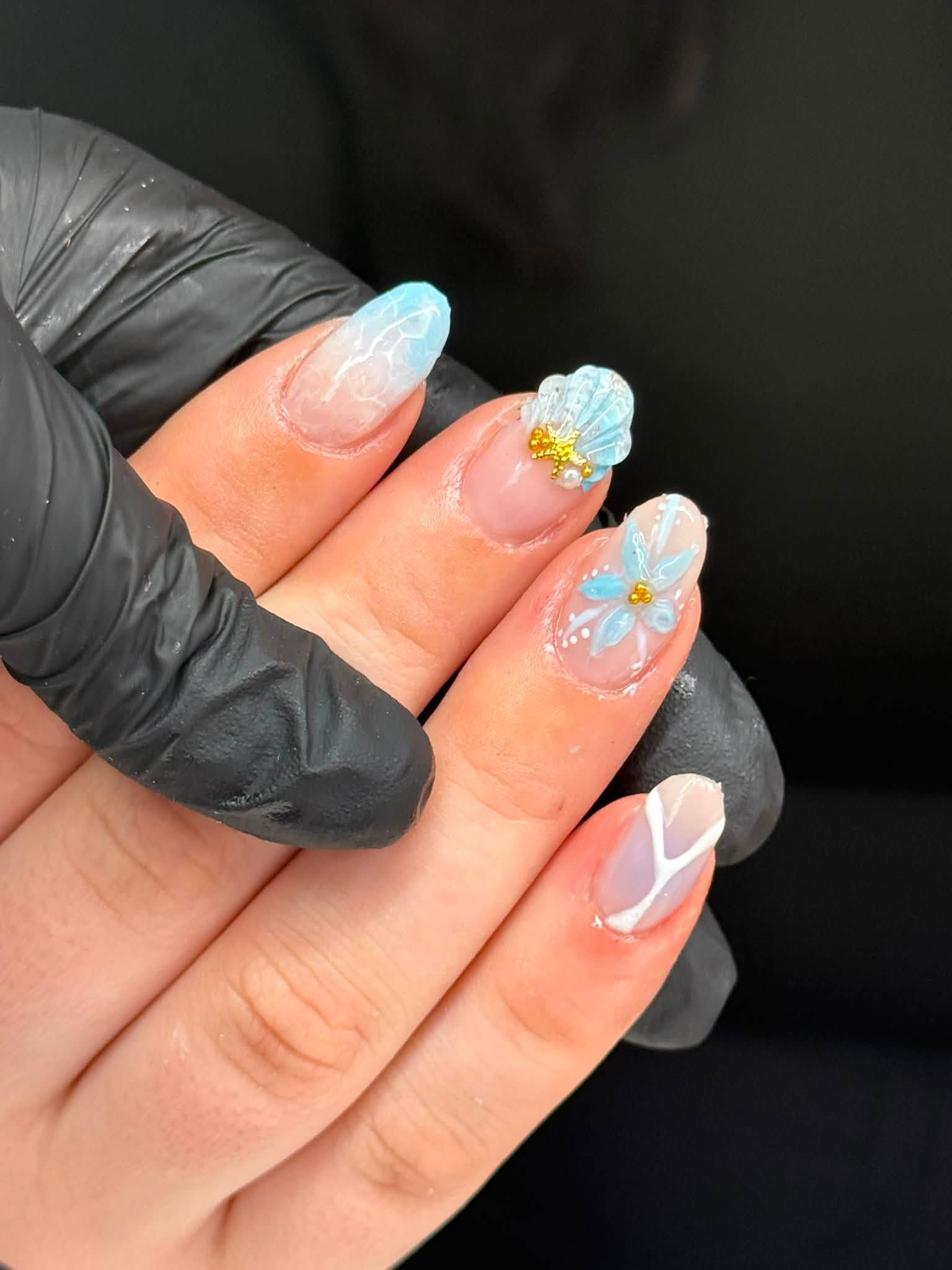 Hand-painted 3D floral and shell nail art